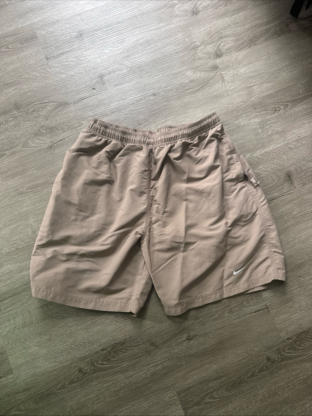 Nike Beige Athletic Shorts with White Swoosh